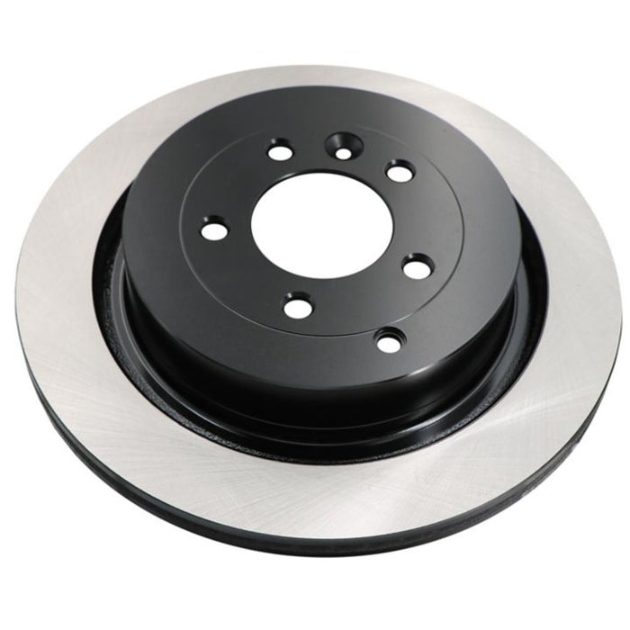 The C09064 ProSeries OE+ Brake Rotor is a black and silver circular car brake rotor with multiple holes in the center.