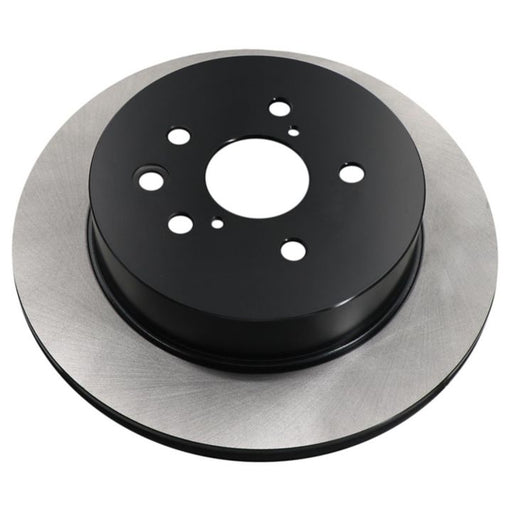 A close-up of the C09125 ProSeries OE+ Brake Rotor, featuring a metallic disc with a black center and multiple attachment holes.