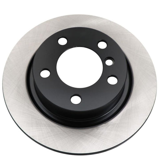 The C09545 ProSeries OE+ Brake Rotor features a sleek black center and a silver outer edge, along with multiple bolt holes.