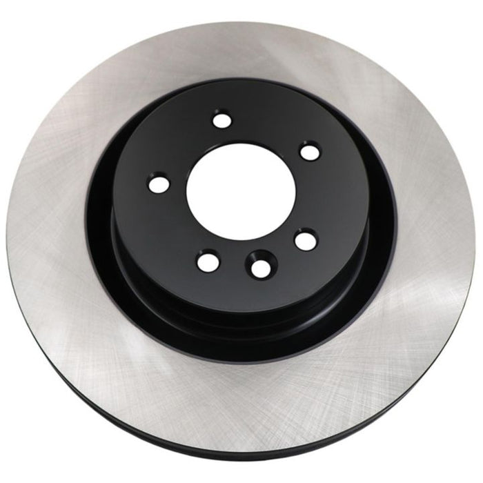 A C09699 ProSeries OE+ Brake Rotor featuring a metallic design with a black center and polished outer ring.