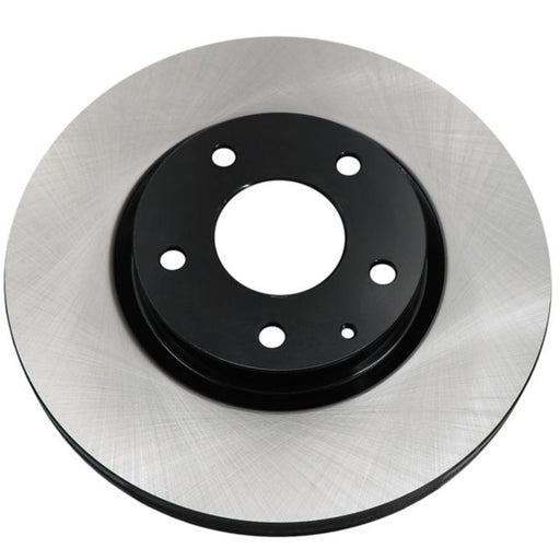 The C10084 ProSeries OE+ Brake Rotor features a single brake disc rotor with a smooth, shiny silver surface and a black central hub with several holes.